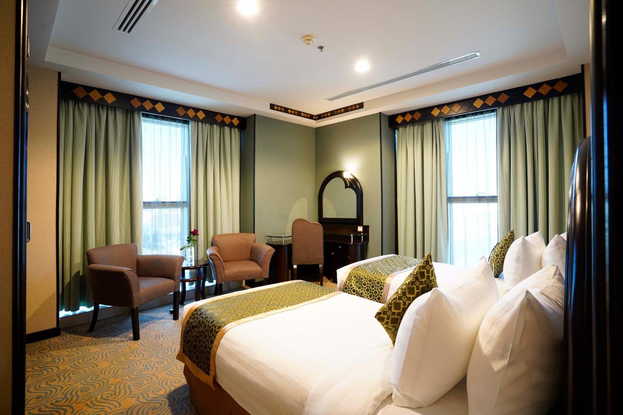Awaliv International Hotel Ta'if Camera foto A bedroom at the hotel